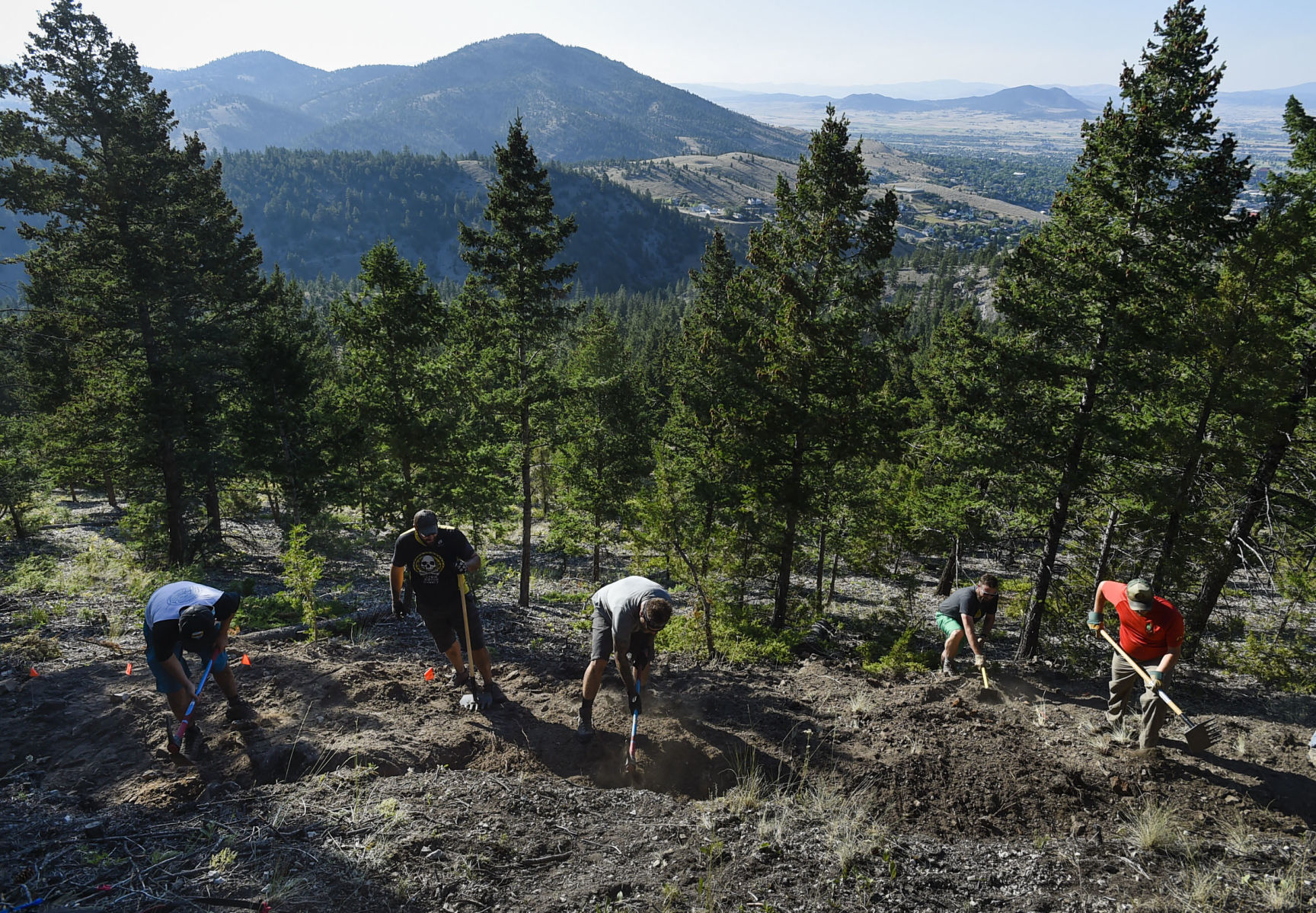 Volunteers help build a trail on Mount Ascension